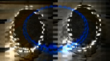 Gas ring lit with flickering blue flame