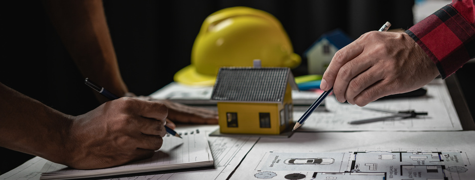 tradespeople mocking up project plans