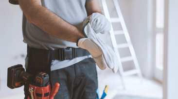 Man with tools and gloves