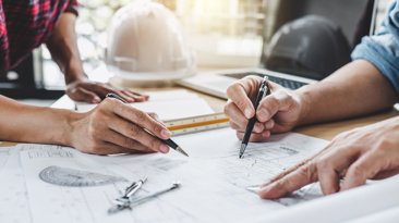 Homeowner and building reviewing building design