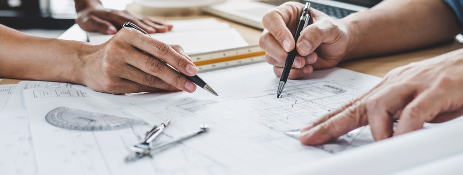 Homeowner and building reviewing building design