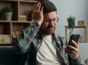 Homeowner on the phone looking worried