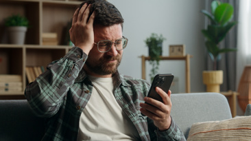 Homeowner on the phone looking worried