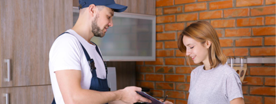 a tradesman helping out a homeowner