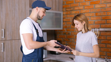 a tradesman helping out a homeowner