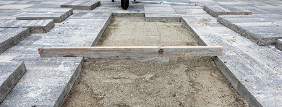 Paving work in progress, laying concrete slabs