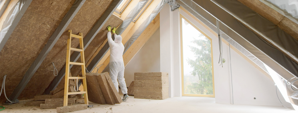 Insulation being installed in loft